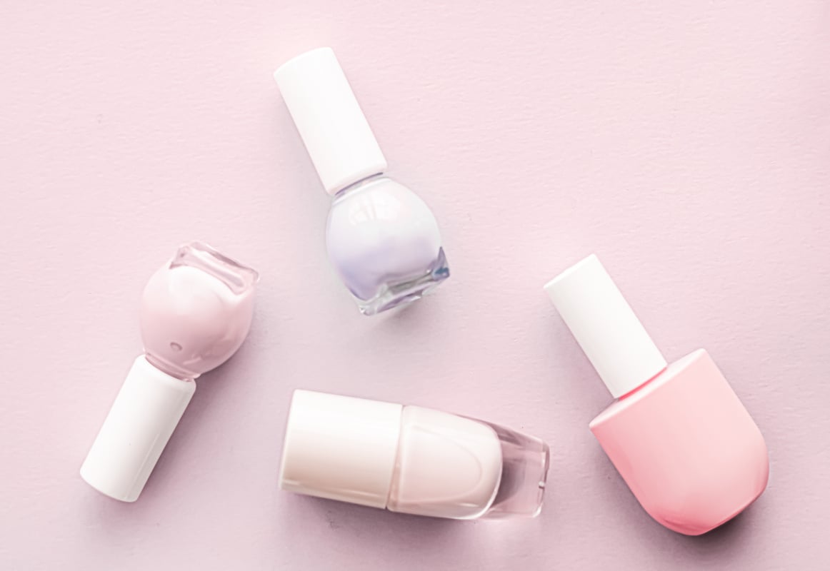 Nail Polish Bottles on Blush Pink Background, Beauty Brand